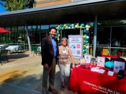 dean mizzy and president koppell at library table